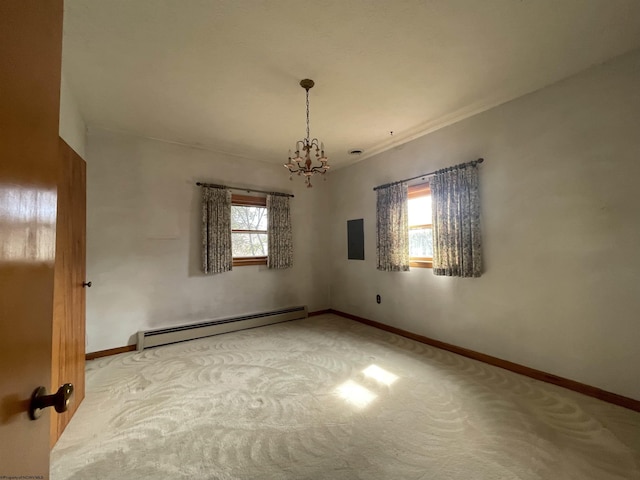 carpeted spare room featuring electric panel, baseboards, baseboard heating, and a notable chandelier