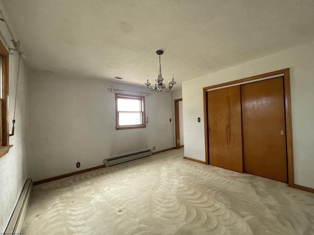 unfurnished bedroom with light carpet, an inviting chandelier, baseboards, and baseboard heating