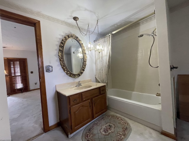 bathroom featuring shower / tub combo, vanity, and an inviting chandelier