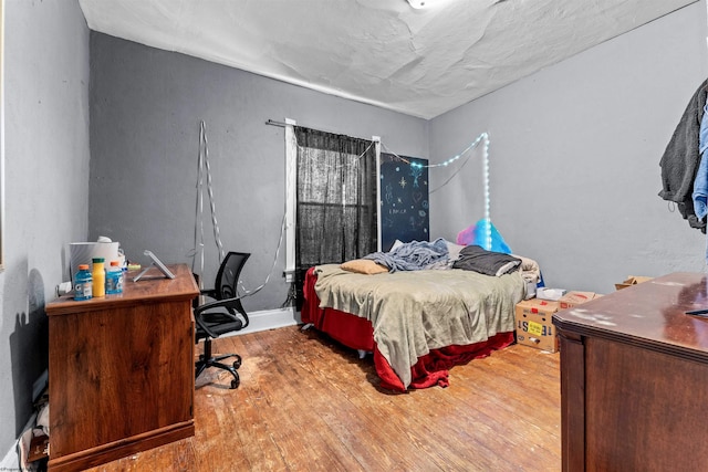 bedroom featuring hardwood / wood-style flooring