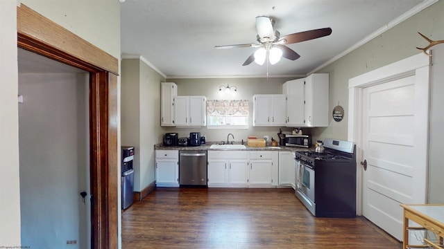 kitchen with ornamental molding, appliances with stainless steel finishes, a sink, and white cabinets