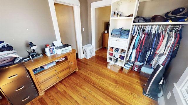 bedroom with a closet and light wood-style flooring