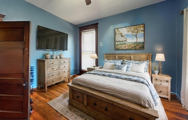 bedroom with ceiling fan and wood finished floors