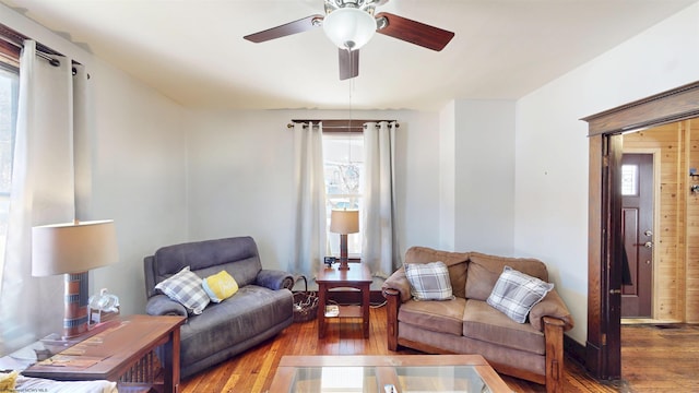 living room with ceiling fan, hardwood / wood-style flooring, and a healthy amount of sunlight