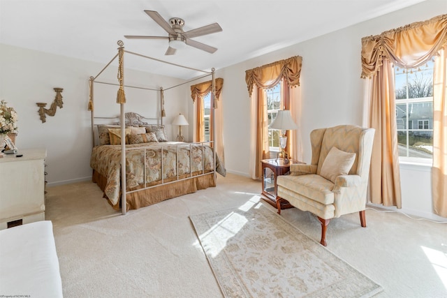 bedroom featuring carpet floors, baseboards, and a ceiling fan