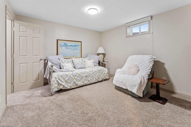 carpeted bedroom featuring baseboards