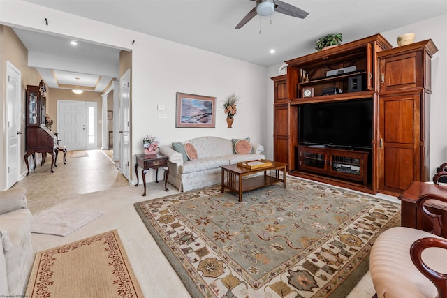 living room with light carpet, ceiling fan, and recessed lighting