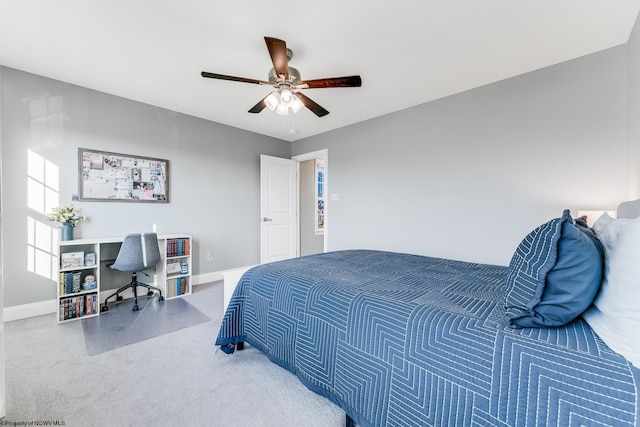 bedroom with ceiling fan and baseboards