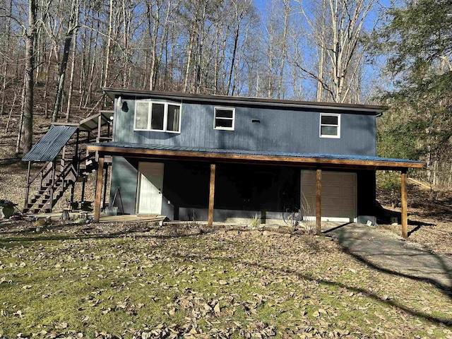 exterior space featuring stairway and an attached garage