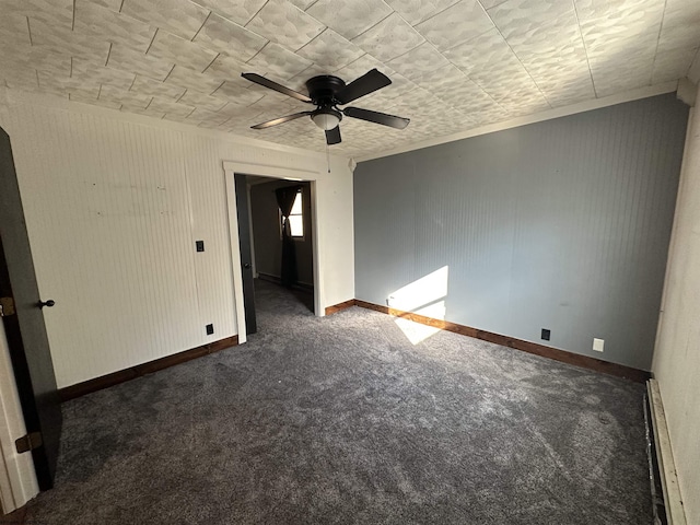 carpeted spare room featuring baseboards, a baseboard heating unit, and ceiling fan