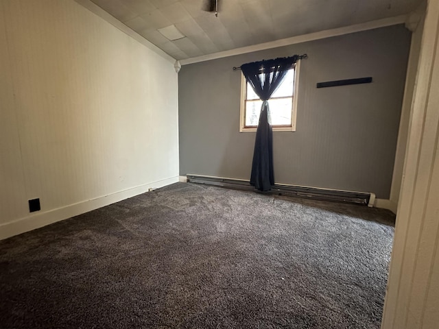 empty room featuring lofted ceiling, baseboards, and dark carpet