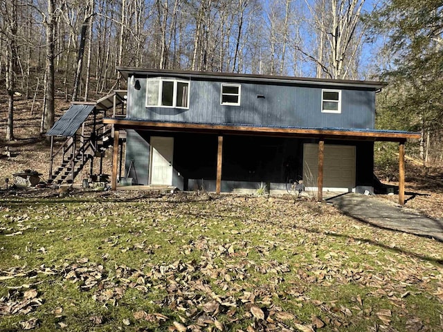 view of outdoor structure with stairway and an attached garage