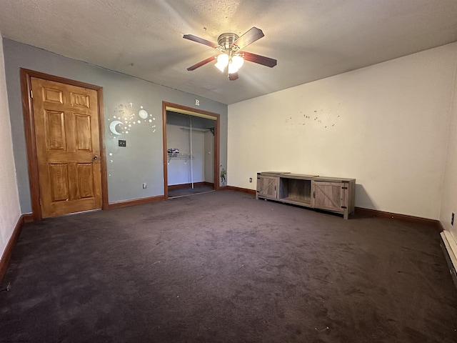 empty room featuring ceiling fan, a textured ceiling, carpet flooring, and baseboards