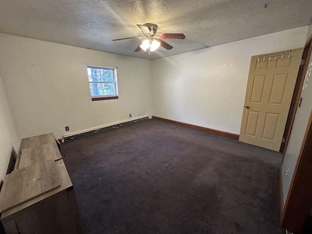 empty room with a textured ceiling, dark carpet, a baseboard radiator, and a ceiling fan