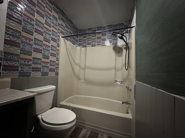 bathroom with shower / washtub combination, vanity, and toilet