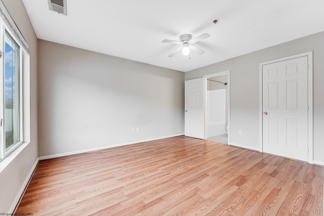 unfurnished bedroom with baseboards, visible vents, ceiling fan, and light wood finished floors