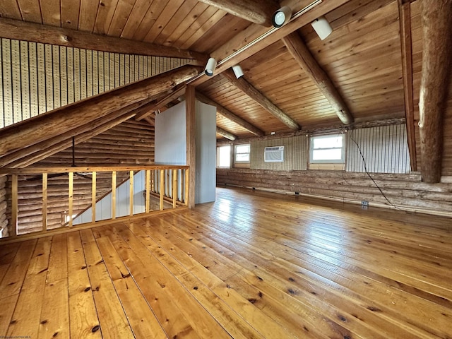 additional living space featuring vaulted ceiling with beams, wood-type flooring, and wood ceiling