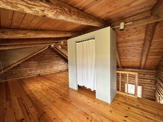 bonus room featuring wooden ceiling, wood-type flooring, and beam ceiling