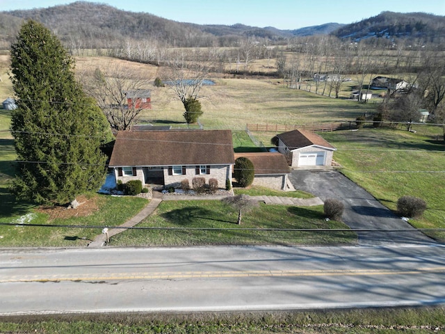 drone / aerial view featuring a mountain view and a rural view