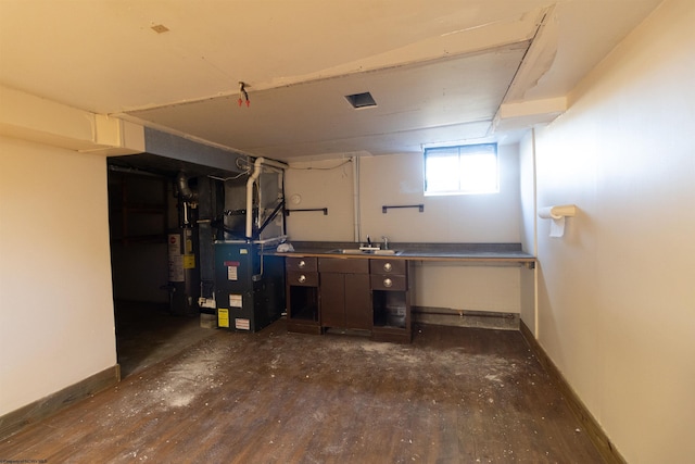 3508 Old Mill Rd, Weston, WV 26452 - basement featuring a sink, gas water heater, heating unit, and baseboards