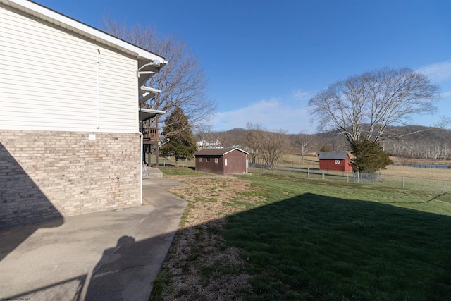 3508 Old Mill Rd, Weston, WV 26452 - view of yard featuring a storage shed, an outdoor structure, and fence