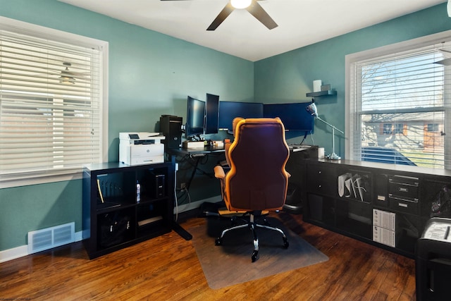 office with baseboards, ceiling fan, visible vents, and wood finished floors