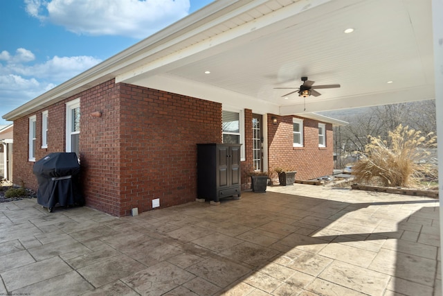 view of patio featuring a grill and ceiling fan