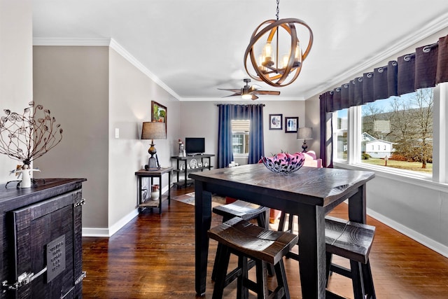 dining room featuring baseboards, ceiling fan with notable chandelier, wood finished floors, and crown molding