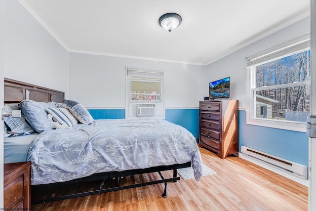 bedroom with a baseboard heating unit, cooling unit, wood finished floors, and crown molding