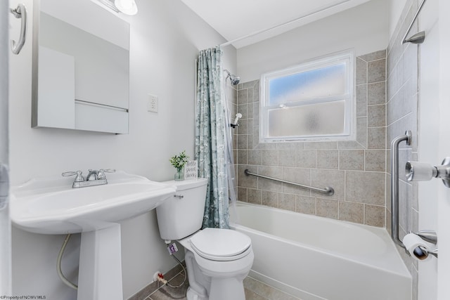 full bath featuring shower / tub combo, a sink, and toilet