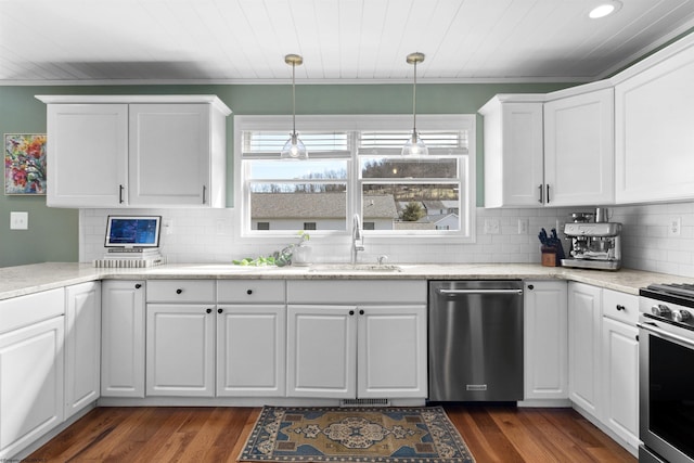 kitchen featuring dark wood-style floors, plenty of natural light, appliances with stainless steel finishes, and a sink