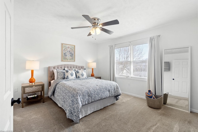 carpeted bedroom featuring ceiling fan and baseboards