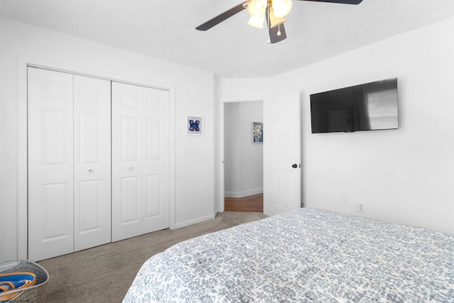 carpeted bedroom featuring a closet, a ceiling fan, and baseboards