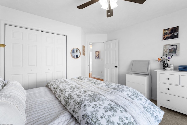 bedroom featuring a closet, carpet flooring, and a ceiling fan