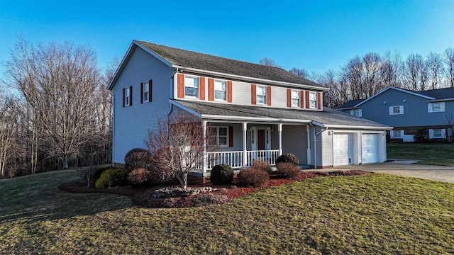 traditional home with a garage, covered porch, a front lawn, and concrete driveway