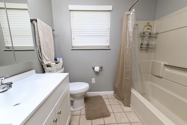 full bath with shower / tub combo, baseboards, toilet, tile patterned flooring, and vanity