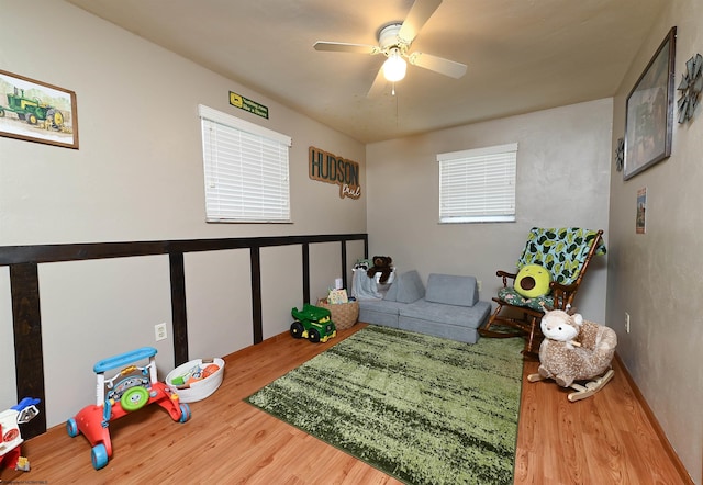 recreation room featuring wood finished floors and a ceiling fan