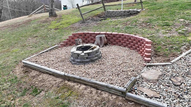 view of yard with an outdoor fire pit