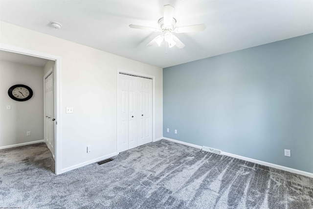 unfurnished bedroom with baseboards, visible vents, and carpet flooring