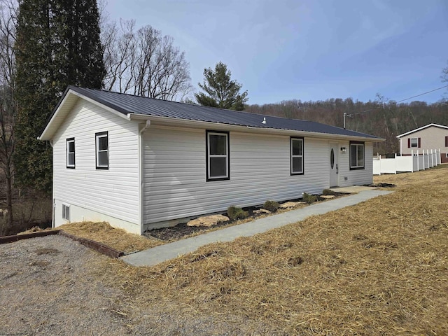 exterior space featuring metal roof