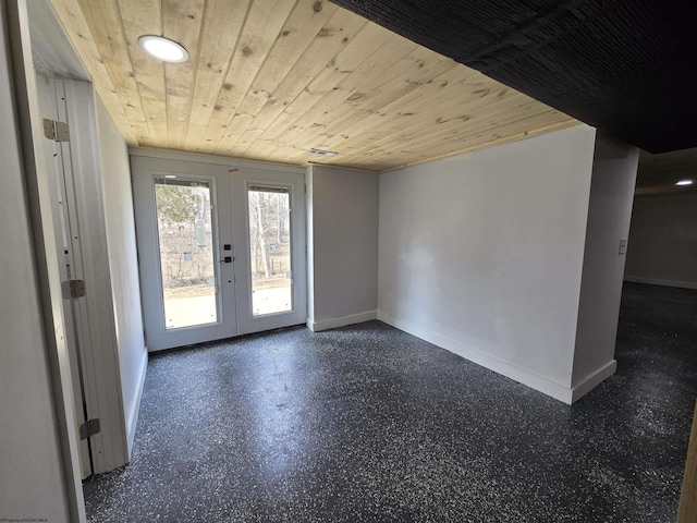 interior space with wooden ceiling and baseboards