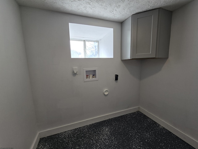 clothes washing area with cabinet space, baseboards, a textured ceiling, washer hookup, and electric dryer hookup