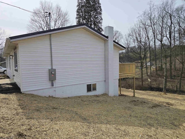 view of side of property featuring a chimney