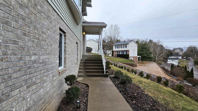 view of side of home featuring brick siding