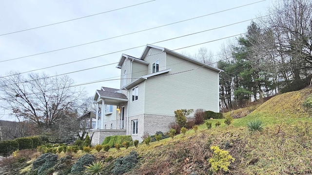 view of side of property with brick siding