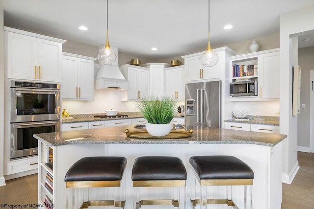 kitchen featuring stainless steel appliances, white cabinets, premium range hood, and open shelves