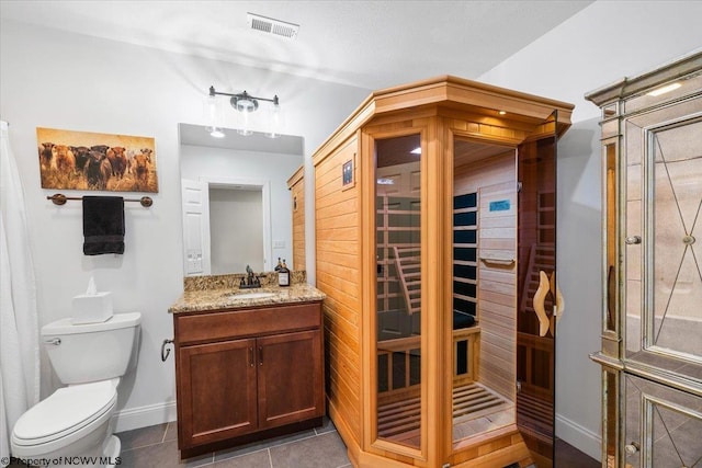 full bathroom featuring visible vents, toilet, vanity, a sauna, and tile patterned flooring