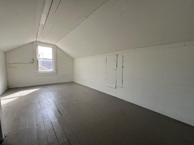 additional living space with lofted ceiling and wood-type flooring