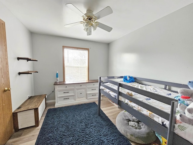 bedroom with light wood-style flooring and ceiling fan