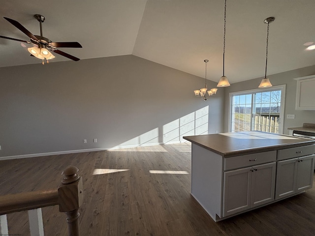 kitchen with a kitchen island, dark wood-style flooring, vaulted ceiling, and open floor plan